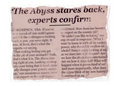 A torn-edge newspaper clipping with a headline reading “The Abyss stares back, experts confirm” and several columns of printed text on aged beige paper against a white background.